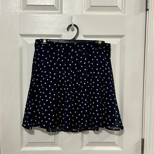 Navy pleated miniskirt with polka dots